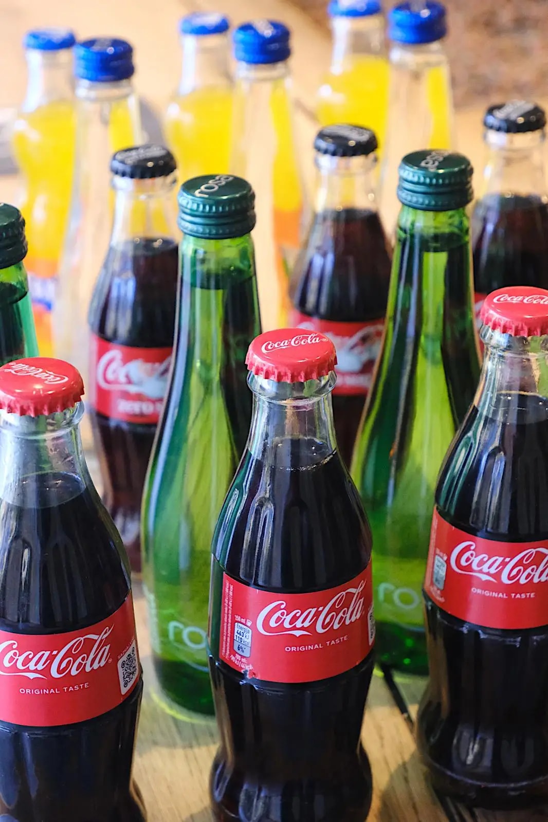 Bottles of Coca-Cola, Fanta and Rosa